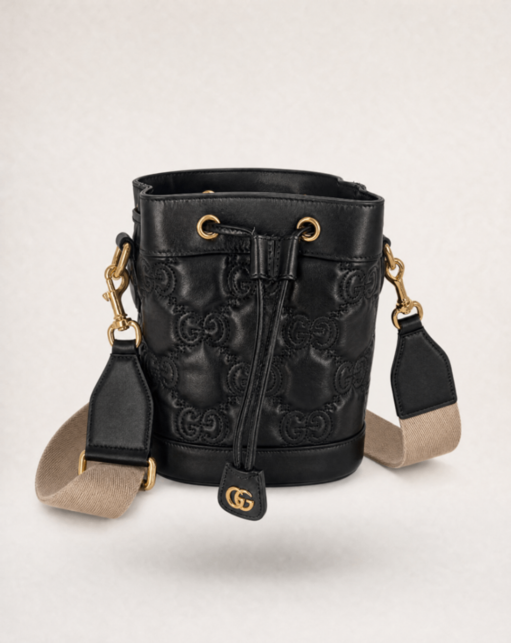Sac seau GG matelassé cuir noir – Gucci – Bandoulière bicolore
