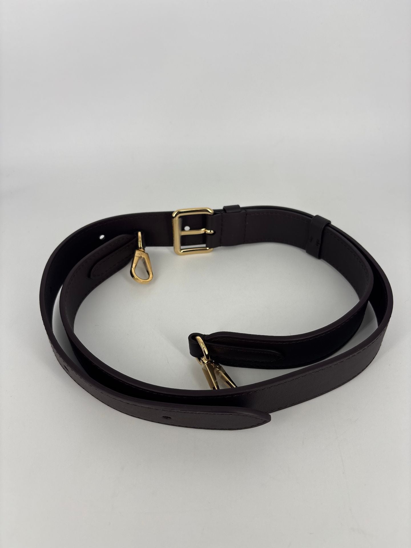 Bandoulière Louis Vuitton cuir noir crochets dorés
